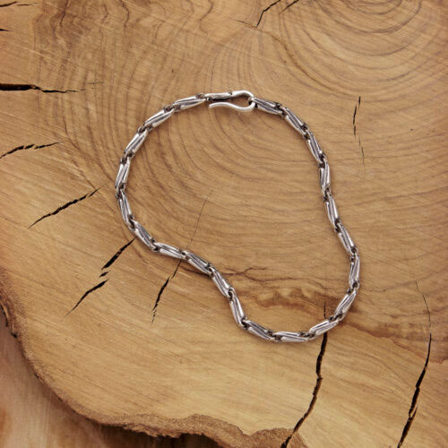 Silver Beaded Chain Bracelet with an oxidized finish on a wooden background