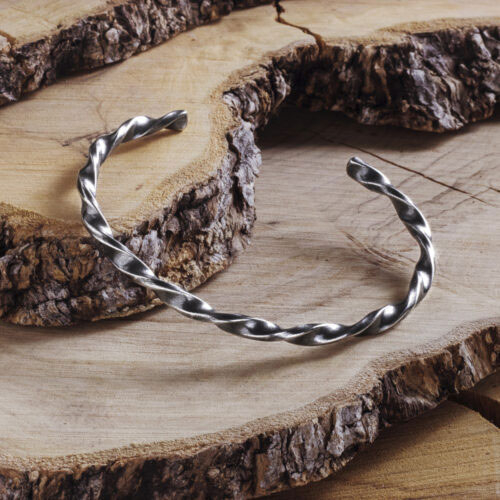 Spiral Bracelet made of sterling silver with an Oxidized Finish on wooden background