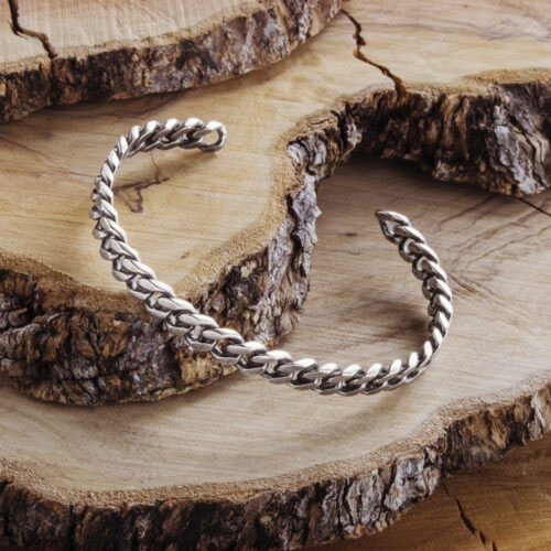 Open Bangle Bracelet with a Silver Oxidized Fixed Chain on a wooden background