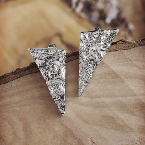 Rustic Stud Earrings with a Triangle Shape on a Wooden Background