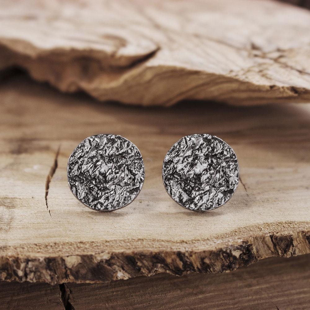 Oxidized Round Stud Earrings on a Wooden Background