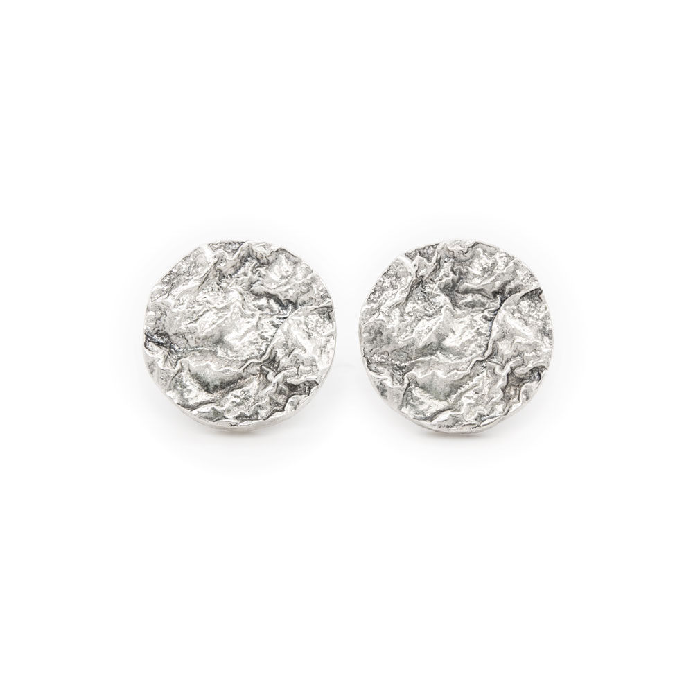 Disc Stud Earrings with a Textured Surface in Sterling Silver on a white background