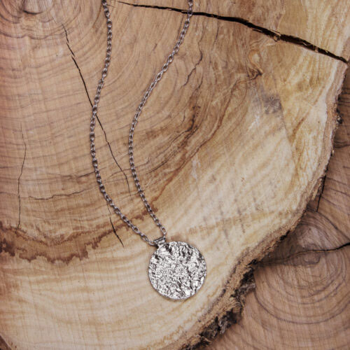 Small Circle Pendant with a Textured Surface in Sterling Silver