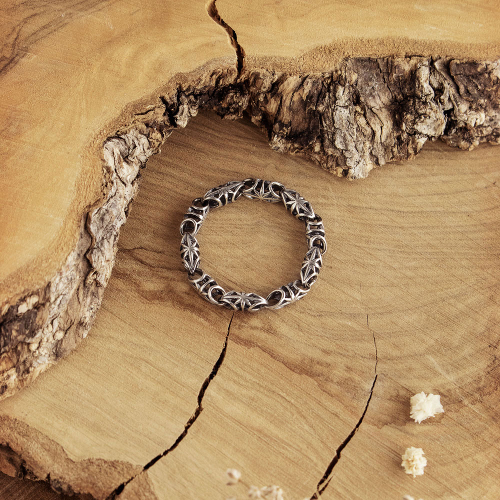Oxidized Chain Ring with Artisan Links in Sterling Silver on a wooden background