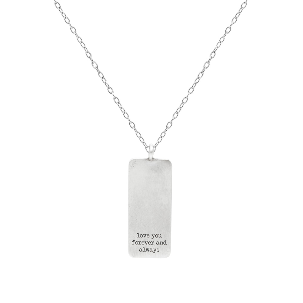 A personalized tag pendant necklace wth a chain in sterling silver beautifully displayed on a white background