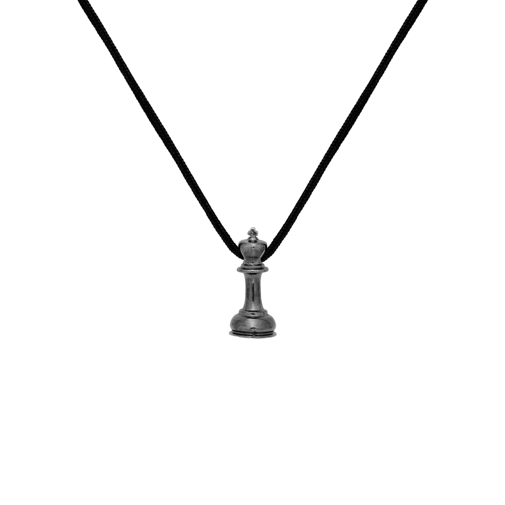 Black King Chess Piece Necklace in Oxidized Sterling Silver with a black cord diplayed on a white background.